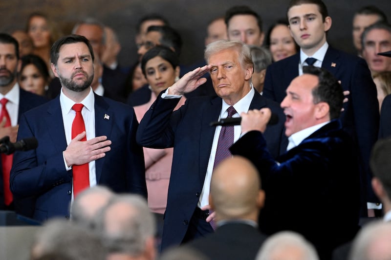 Vice President JD Vance and President Donald Trump stand as singer Christopher Macchio performs "The Star-Spangled Banner" after Trump was sworn in as the 47th U.S. President on January 20, 2025.