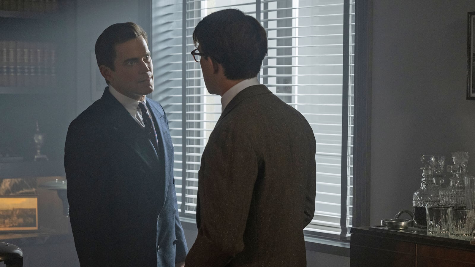 Matt Bomer talks to Jonathan Bailey in a still from 'Fellow Travelers'
