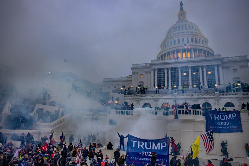 WASHINGTON,DC-JAN6: Tear gas is fired at supporters of President Trump who stormed the United States Capitol building.  (Photo by Evelyn Hockstein/For The Washington Post via Getty Images)