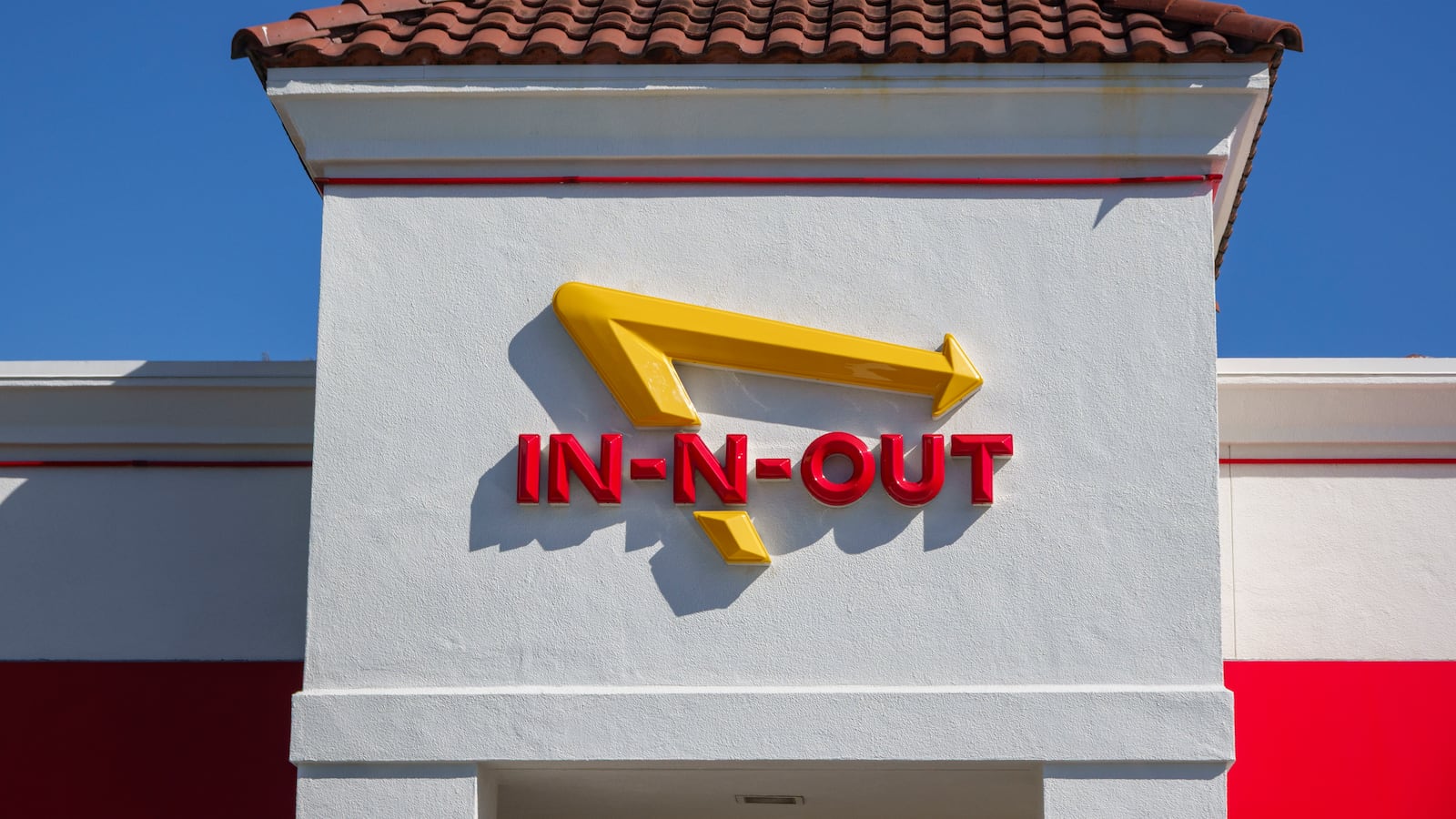 CARLSBAD, CALIFORNIA - NOVEMBER 7: An In-N-Out Burger logo is displayed outside a restaurant on November 7, 2025 in Carlsbad, CA. (Photo by Kevin Carter/Getty Images)