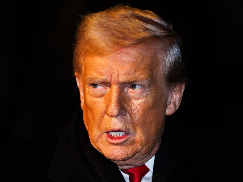 President Donald Trump walks over to reporters to make a brief statement before departing from the South Lawn of the White House in Marine One on January 20, 2026 in Washington, DC.