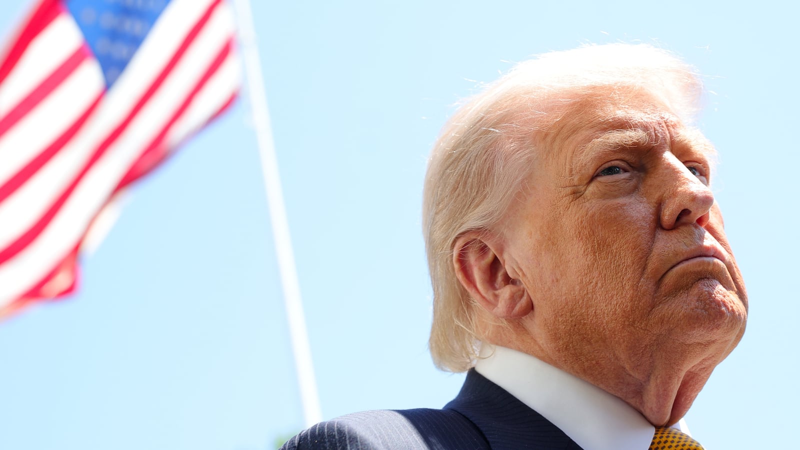 WASHINGTON, DC - MAY 12: U.S. President Donald Trump speaks in front of the American flag to the press as he departs the White House on May 12, 2026 in Washington, DC. Trump is traveling to China, where he is scheduled to meet with Chinese President Xi Jinping for expected talks on the Iran conflict, trade imbalances, regional security, and economic cooperation between the two countries. (Photo by Kevin Dietsch/Getty Images)