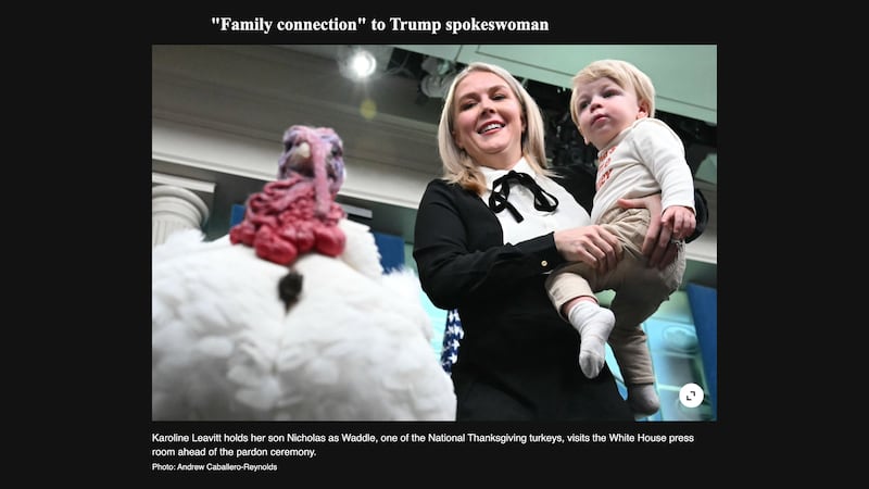 A screen grab from Tages-Anzeiger of the photo of Karoline Leavitt with her son Nicholas, and Waddle, one of the National Thanksgiving turkeys, in the press briefing room of the White House, prior to the turkey pardoning ceremony with President Donald Trump on Nov. 25, 2025, in Washington, DC., before being pulled by the AFP.