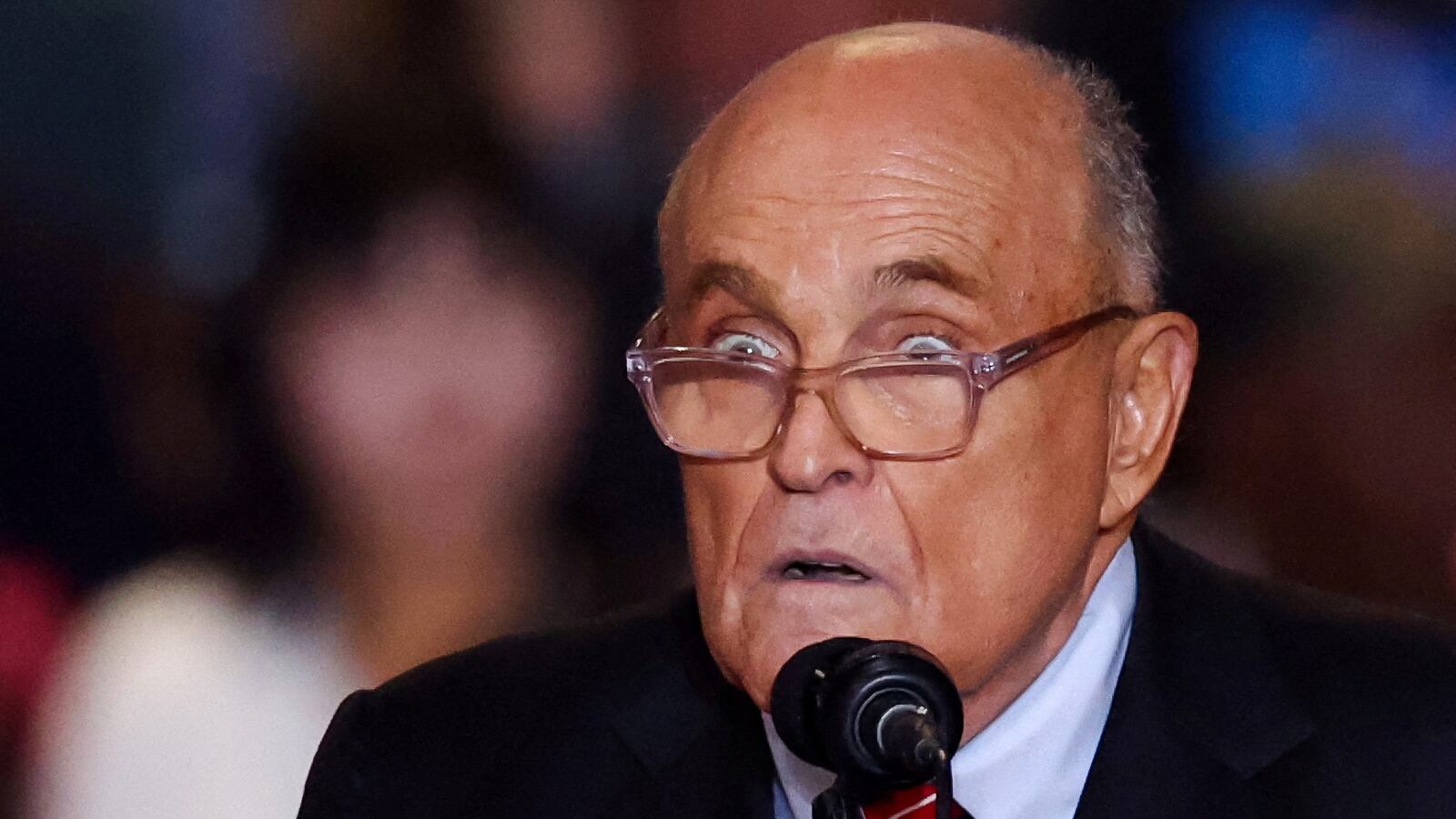 Rudy Giuliani reacts at the Nassau Veterans Memorial Coliseum during a rally held by Republican presidential nominees and former U.S. President Donald Trump