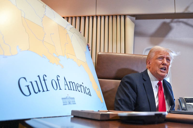 US President Donald Trump speaks to the press before signing a proclamation renaming the Gulf of Mexico as the Gulf of America aboard Air Force One enroute to New Orleans, Louisiana on Febrary 09, 2025.