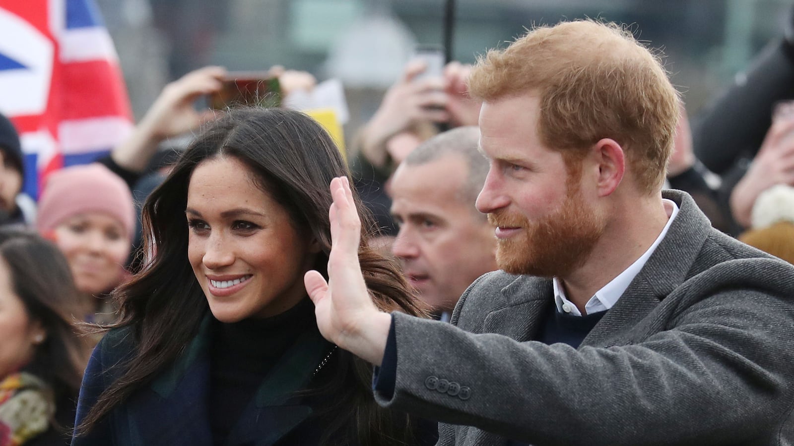Meghan Markle and Prince Harry meet members of the public during a walkabout on the esplanade at Edinburgh Castle, Britain.