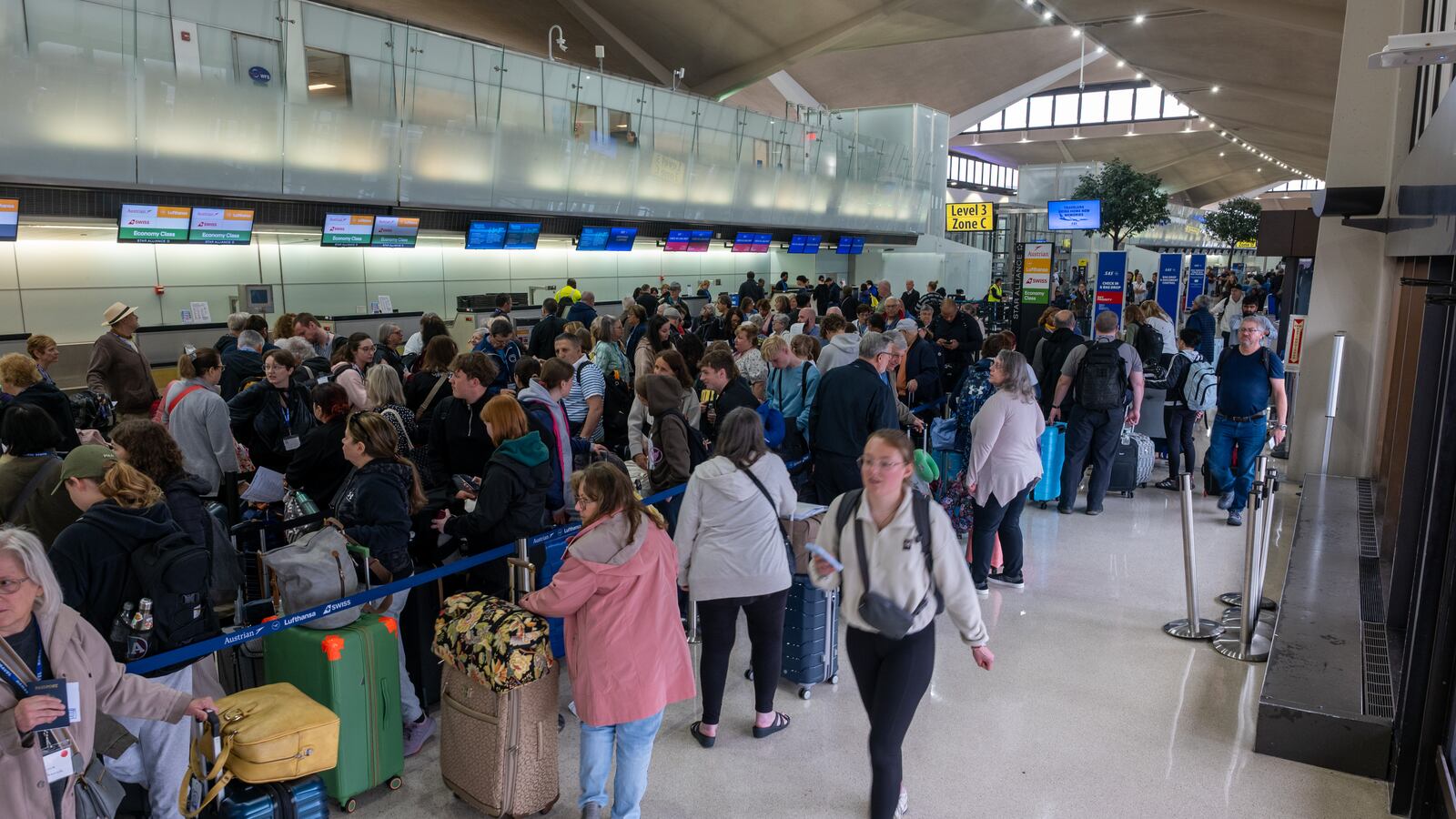 NEWARK, NEW JERSEY - MAY 05: People wait in line for a delayed flight at Newark International Airport on May 05, 2025 in Newark, New Jersey. Delays and cancellations at one of the nation's busiest airports have persisted for about a week, with these disruptions continuing into Monday morning. Air traffic control outages, runway construction, and an announcement by United Airlines that over 20% of FAA controllers at Newark walked off the job have all contributed to delays and cancellations. (Photo by Spencer Platt/Getty Images)