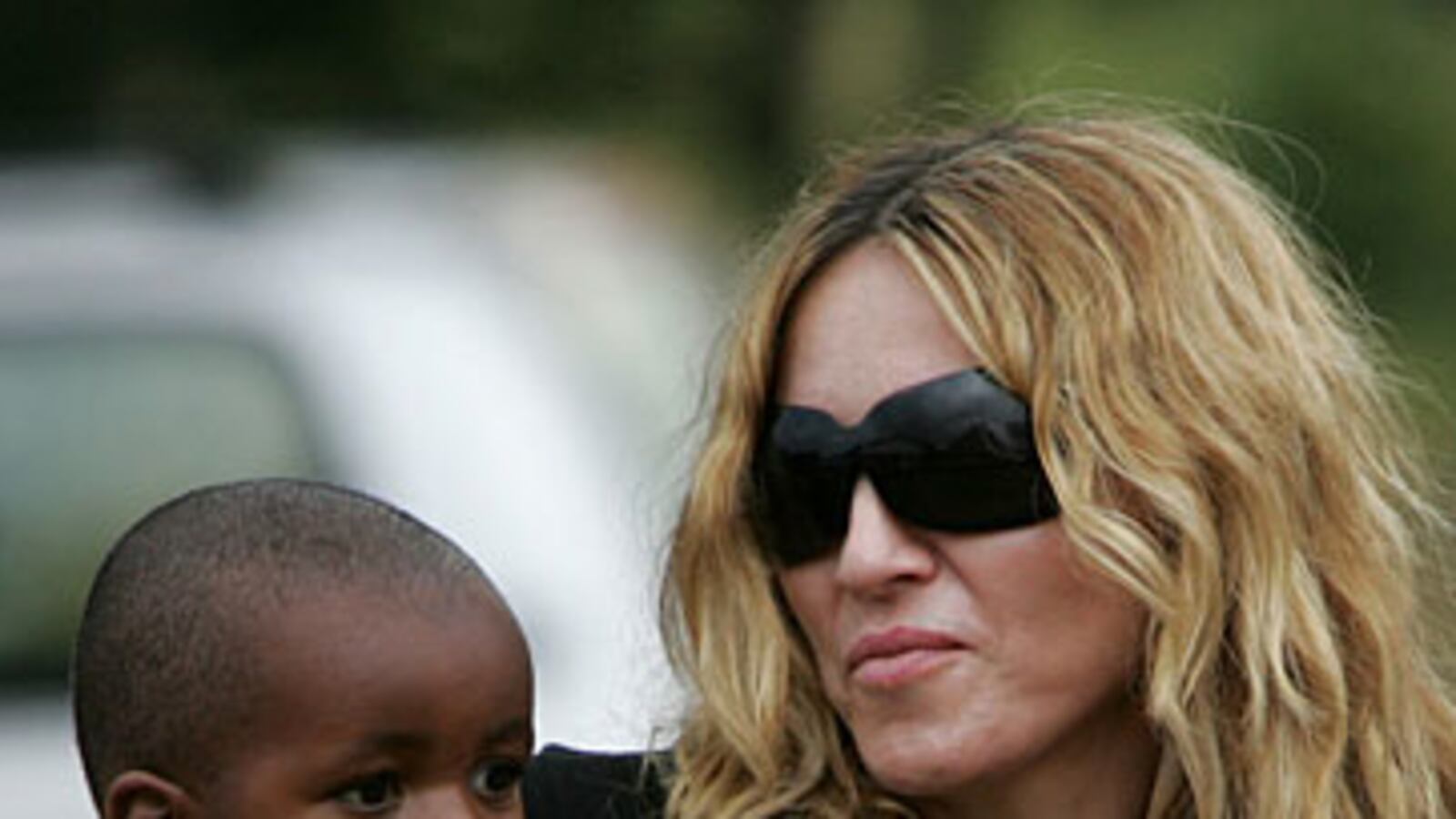 cheats/2009/03/28/is-madonna-breaking-up-families/madonna-adoption_frfwvb