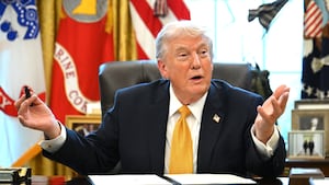 US President Donald Trump speaks while signing an executive order on fraud in the Oval Office at the White House
