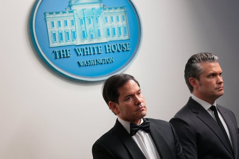 U.S. Secretary of Defense Pete Hegseth and U.S. Secretary of State Marco Rubio look on as U.S. President Donald Trump holds a press briefing at the White House, following a shooting incident during the annual White House Correspondents’ Association dinner, in Washington, D.C., U.S., April 25, 2026.