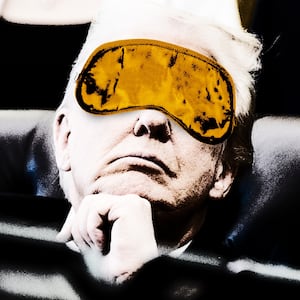 Donald Trump wearing a sleep mask while in a meeting.