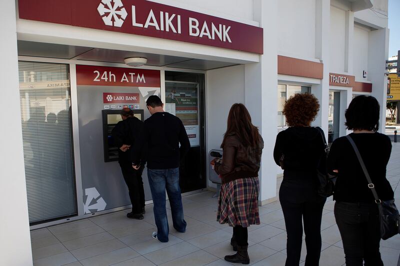 articles/2013/03/17/after-cyprus-bank-bailout-depositors-race-to-withdraw-their-cash-is-the-rest-of-europe-next/130317-McArdle-Cyprus-ATM-tease_ihqrlx