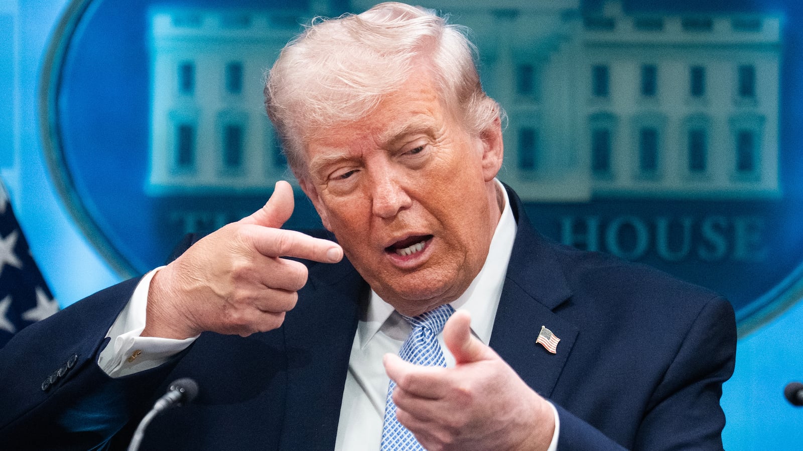 President Donald Trump mimics firing a gun during a news conference in the White House briefing room about the war in Iran on Monday, April 6, 2026.
