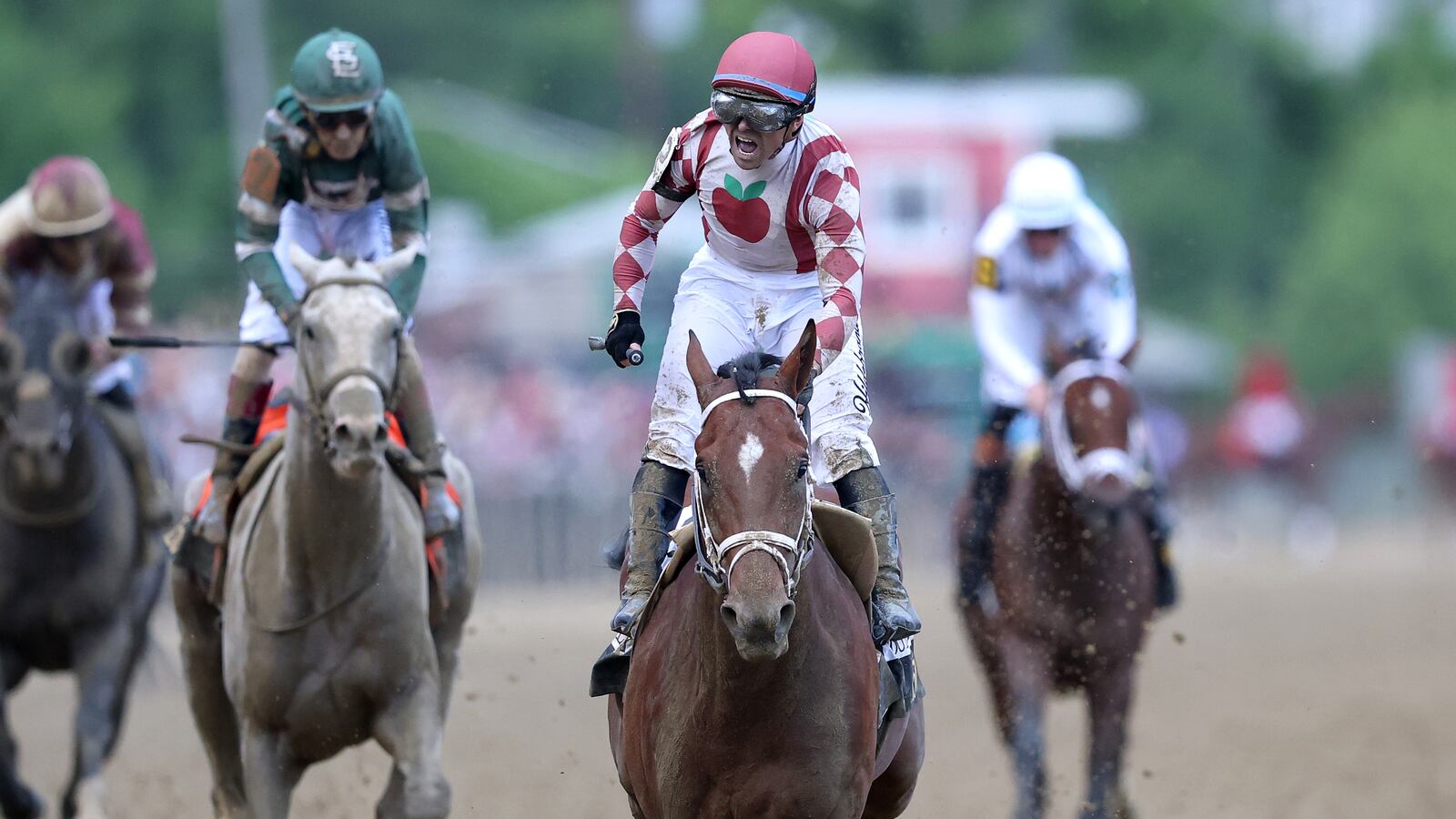 BALTIMORE, MARYLAND - MAY 17: Jockey Umberto Rispoli celebrates aboard Journalism #2 ahead of jockey Luis Saez and Gosger #9 after winning the 150th Preakness Stakes the 150th Preakness Stakes at Pimlico Race Course on May 17, 2025 in Baltimore, Maryland. (Photo by Emilee Chinn/Getty Images)