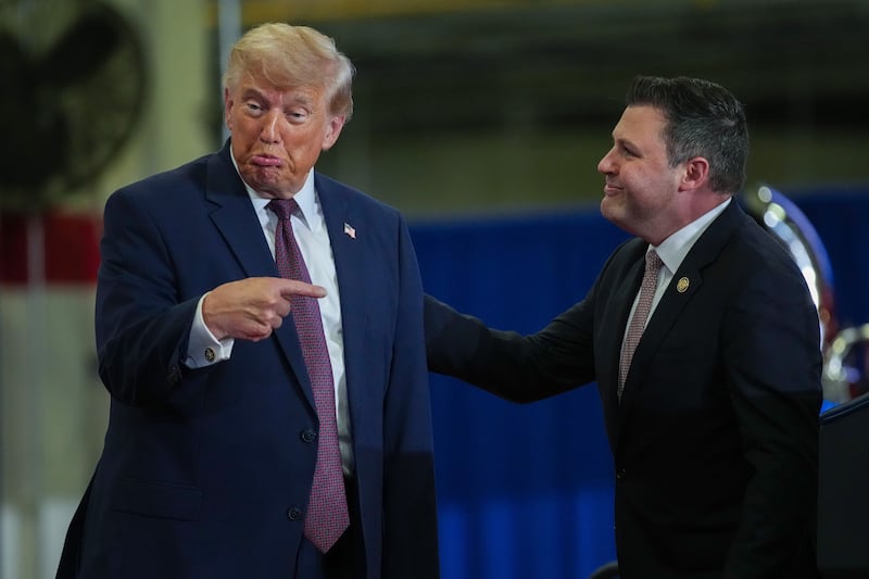 MACUNGIE, PENNSYLVANIA - JUNE 23: Rep. Congressman Ryan Mackenzie (R-PA) (R) joins U.S. President Donald Trump on stage at the Mack Trucks Lehigh Valley Operations facility on June 23, 2026 in Macungie, Pennsylvania. President Trump visited the facility to highlight American manufacturing and its benefits for local economies. (Photo by Andrew Harnik/Getty Images)