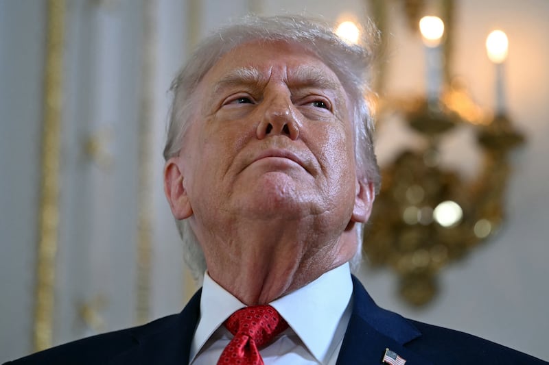 US President Donald Trump arrives to take part in a dedication ceremony for Southern Boulevard, in the ballroom at Mar-a-Lago in Palm Beach, Florida, on January 16, 2026. (Photo by ANDREW CABALLERO-REYNOLDS / AFP via Getty Images)
