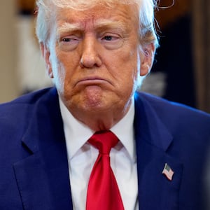 Donald Trump reacts to a question during a Cabinet meeting.