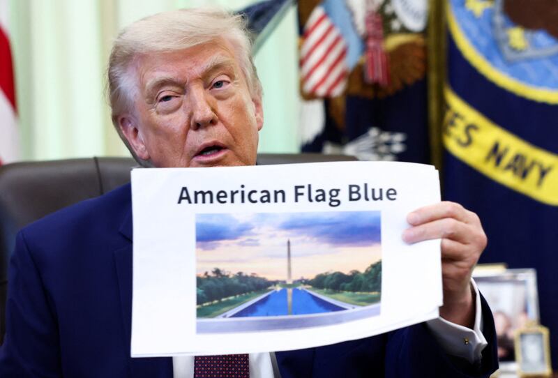 U.S. President Donald Trump holds a reflecting pool image at the Oval Office of the White House, in Washington, D.C., June 3, 2026. REUTERS/Kevin Lamarque
