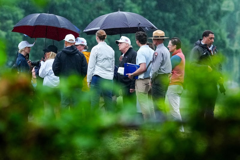 U.S. President Donald Trump reviews plans during his visit to East Potomac Links golf course at Haines Point in Washington, D.C., U.S., June 28, 2026. REUTERS/Ken Cedeno