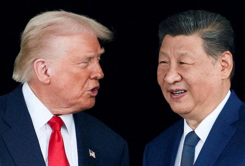 President Donald Trump and Chinese President Xi Jinping talk as they leave after a bilateral meeting at Gimhae International Airport, on the sidelines of the Asia-Pacific Economic Cooperation (APEC) summit, in Busan, South Korea, October 30, 2025.