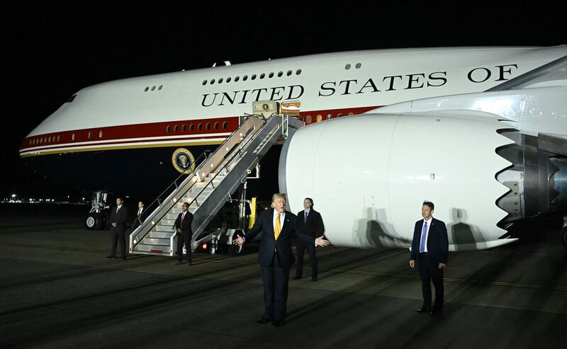 President Donald Trump gestures in front of Air Force One after disembarking from the older VC-25A Air Force One at Royal Air Force (RAF) Mildenhall in Mildenhall, eastern England, on July 8, 2026, before continuing his journey to the United States.