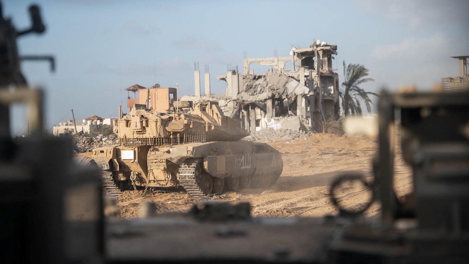 Israeli military vehicle manoeuvres during the ongoing ground operation of the Israeli army against Palestinian Islamist group Hamas, in the Gaza Strip as seen in a handout picture released by the Israel Defense Forces on November 13, 2023.
