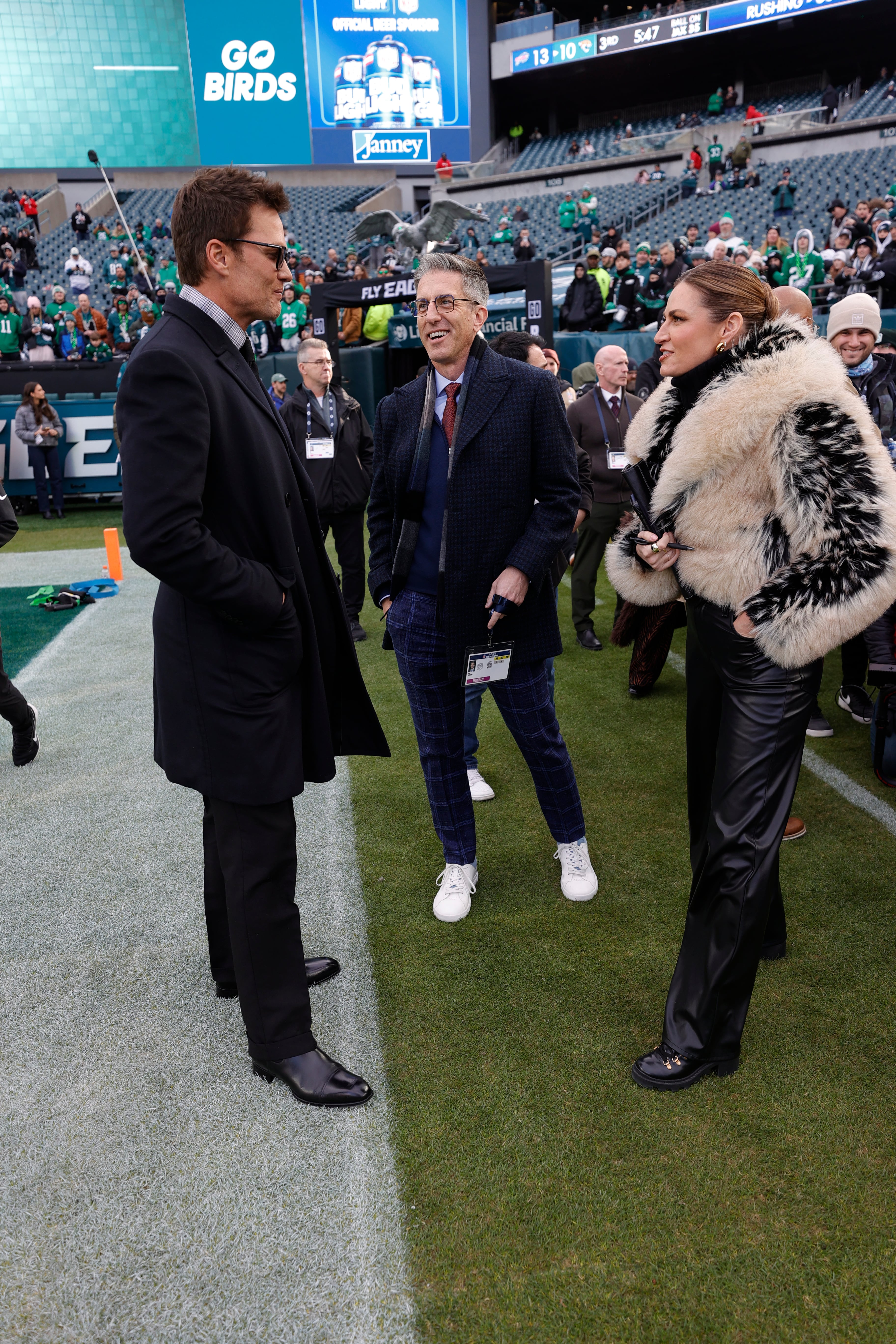 Broadcasters Tom Brady and Erin Andrews at the NFC Wild Card playoff game between the San Francisco 49ers and the Philadelphia Eagles at Lincoln Financial Field on January 11, 2026.