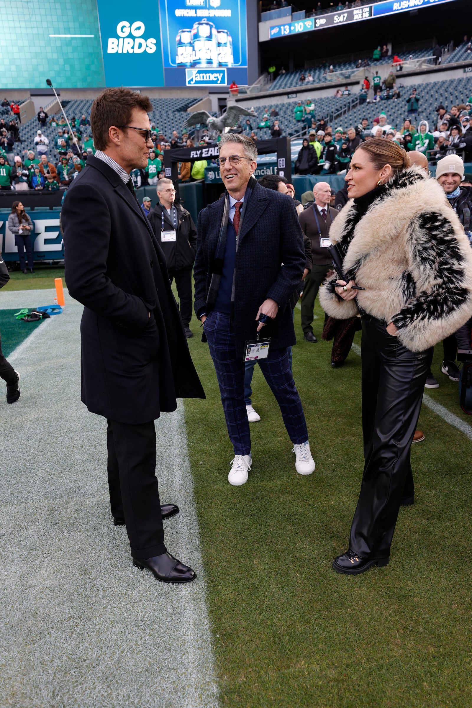Broadcasters Tom Brady and Erin Andrews at the NFC Wild Card playoff game between the San Francisco 49ers and the Philadelphia Eagles at Lincoln Financial Field on January 11, 2026.