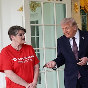 Trump tips Sharon Simmons after receiving a DoorDash delivery of McDonald's during the press conference. Photo by Win McNamee/Getty Images.