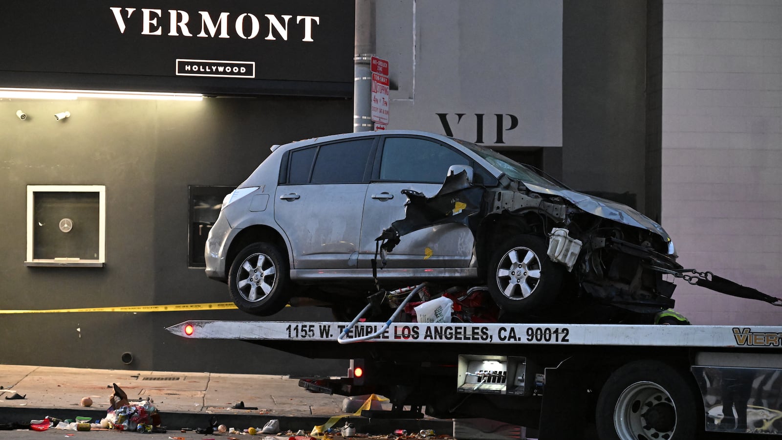 An "unknown vehicle" is being taken away after it drove into a crowd in Hollywood in the early hours of July 19, 2025.