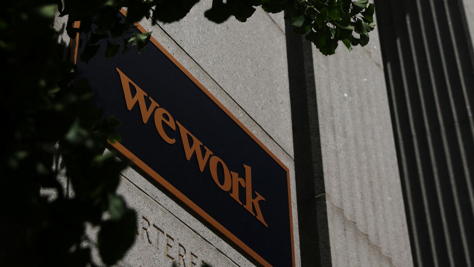 A sign marks a WeWork location in Boston, Massachusetts, U.S., August 14, 2023.