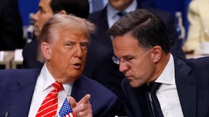 US President Donald Trump (L) speaks with NATO Secretary General Mark Rutte