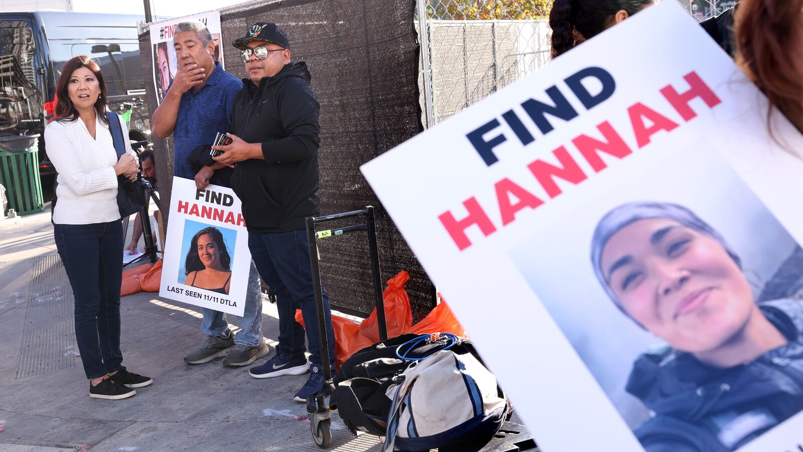 Los Angeles, California November 21, 2024-Volunteers put up flyers of missing Maui woman Hannah Kobayashi outside Crypto.com Arena in Downtown Los Angeles Thursday. (Wally Skalij/Los Angeles Times via Getty Images)