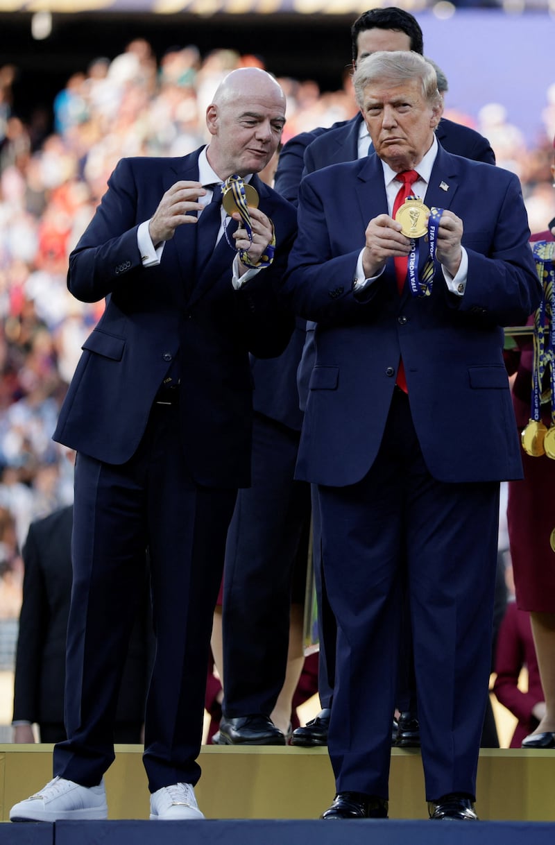 U.S. President Donald Trump and FIFA President Gianni Infantino hold medals during the trophy presentation of the FIFA World Cup 2026 Final at New York New Jersey Stadium in East Rutherford, New Jersey, U.S., July 19, 2026. REUTERS/Evan Vucci