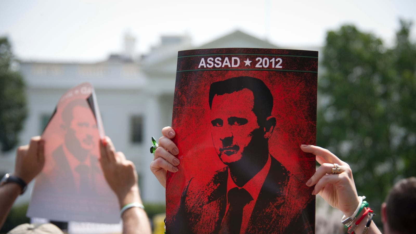 articles/2013/08/31/d-c-protesters-battle-over-obama-s-syria-response/130831-syria-protest-jacobs-tease_dlpzsb