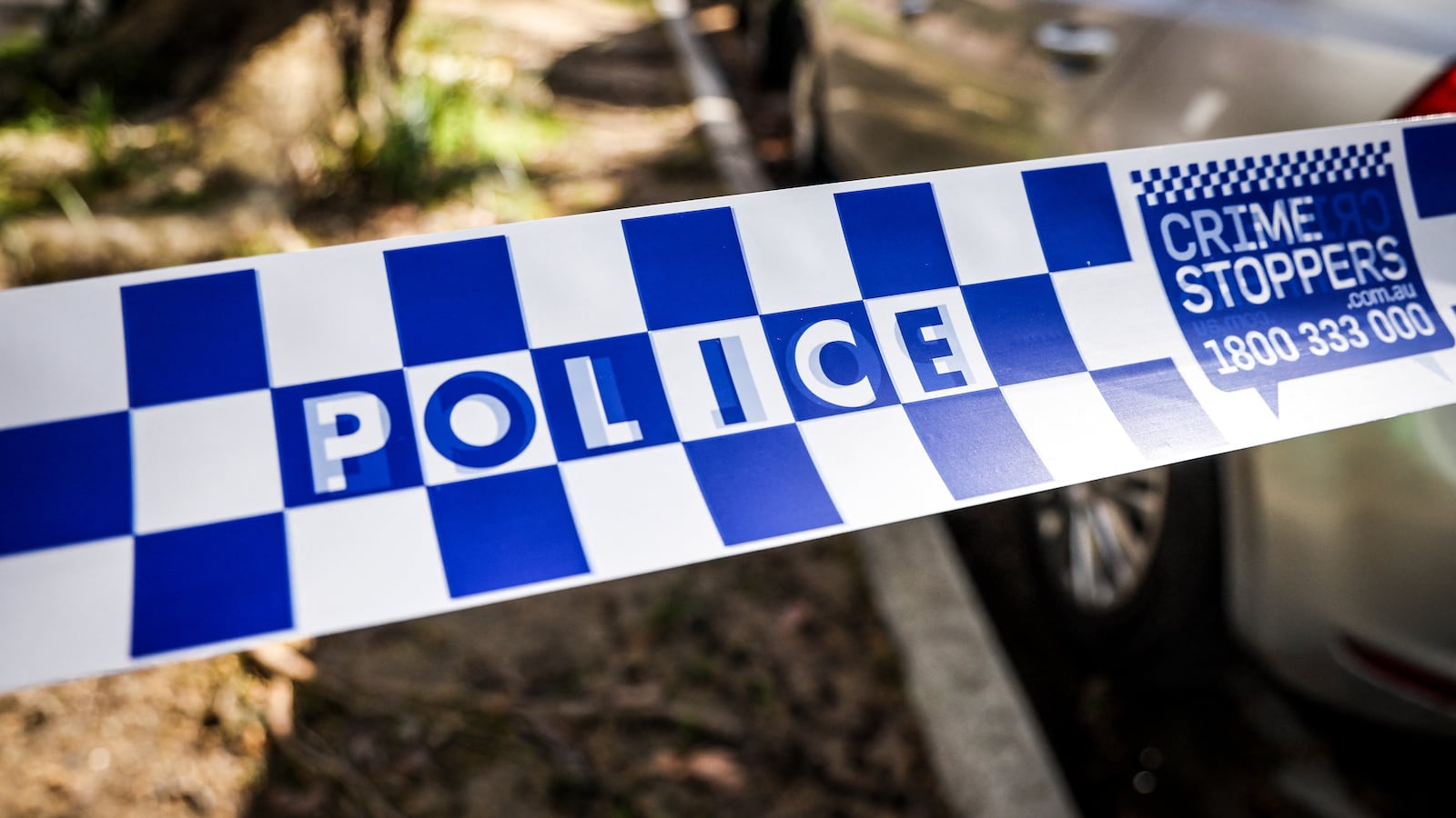 New South Wales (NSW) police tape can be seen across a road near the Russian consulate in Sydney on September 1, 2025.
