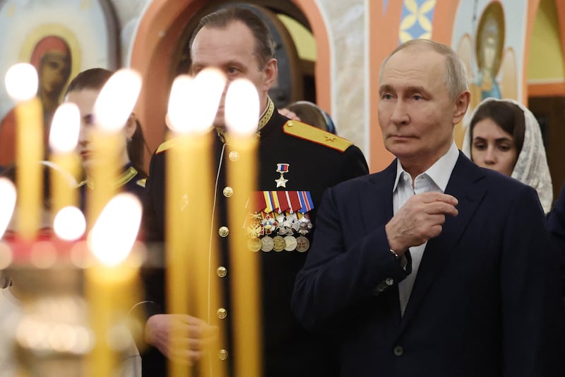 Russia's President Vladimir Putin attends a Christmas service with military personnel and their families at a church in the Moscow Region on Jan. 7, 2026.