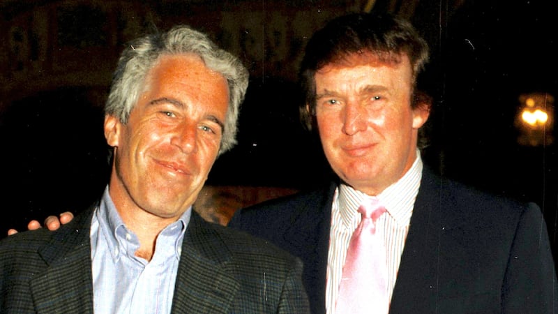 Jeffrey Epstein (left) and Donald Trump as they pose together at the Mar-a-Lago estate, Palm Beach, Florida on February 22, 1997.