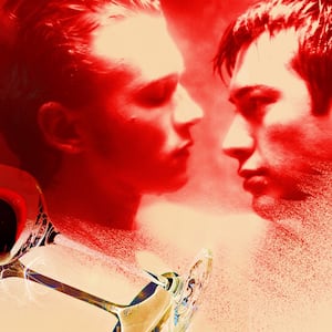 A glass of wine revealing Connor Storrie and Hudson Williams in "Heated Rivalry"