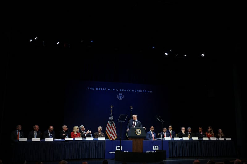 U.S. President Donald Trump delivers remarks to the White House Religious Liberty Commission, as  Television personality Dr. Phil McGraw, Cardinal Timothy Dolan, Pastor Paula White, Texas Lieutenant Governor Dan Patrick, U.S. Attorney General Pam Bondi, U.S. Secretary of Housing and Urban Development Scott Turner, Vice Chair of the Religious Liberty Commission Dr. Ben Carson, Bishop Robert Barron, Pastor Franklin Graham, author Eric Metaxas and Carrie Prejean Boller and Commissioner to Religious Liberty Commission Carrie Prejean sit, at the Museum of the Bible in Washington, D.C., U.S., September 8, 2025. REUTERS/Evelyn Hockstein