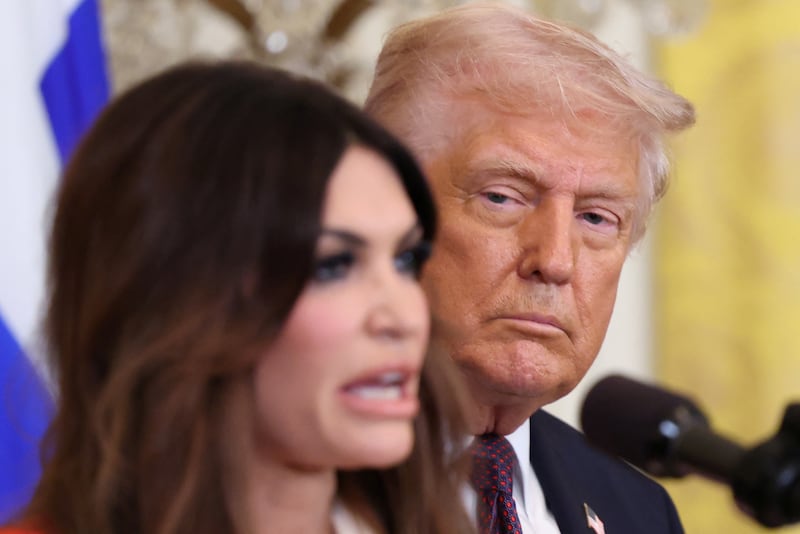 President Donald Trump looking at Kimberly Guilfoyle