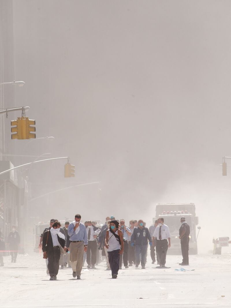 Dust swirls around south Manhattan moments after a tower of the World Trade Center collapsed.