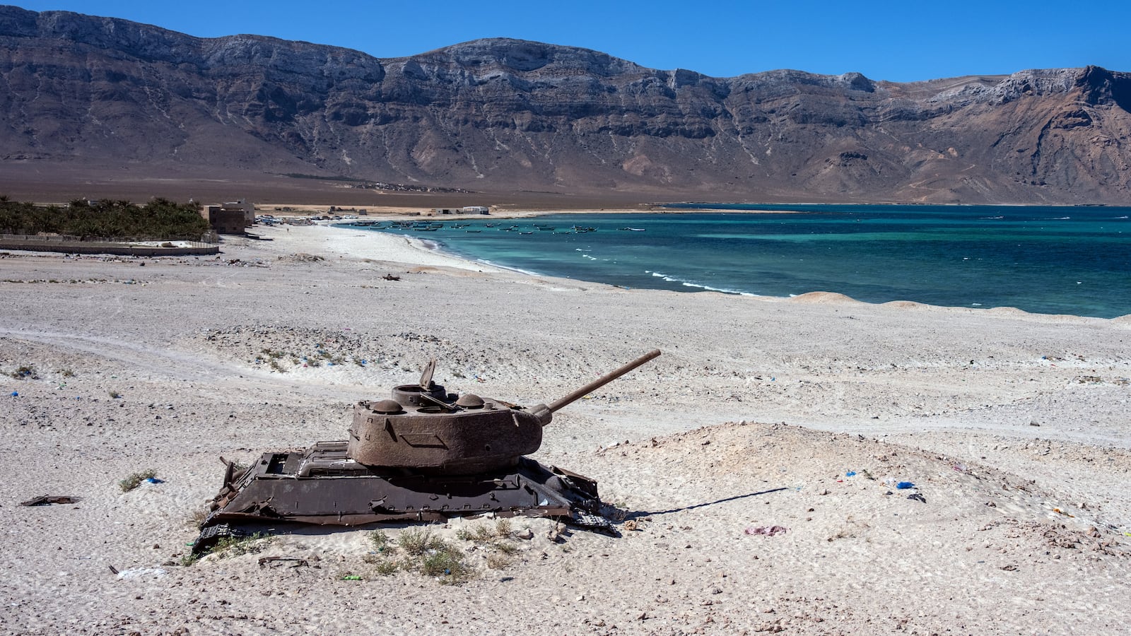SOCOTRA ISLAND, YEMEN - OCTOBER 15: A Soviet tank lies in the sand on October 15, 2025 in Socotra, Yemen. Socotra, the largest island in an eponymous archipelago, lies 150 miles off the Horn of Africa, and even farther from mainland Yemen. Its relative isolation has mitigated the impact of Yemen's long-running and stalemated civil war, rendering it safe enough to attract a small but steady stream of foreign tourists. However, it has not been untouched by regional hostilities. In recent years, the UAE-backed secessionist group Southern Transitional Council wrested control of the island from the Saudi-backed internationally recognized government. The STC ultimately joined the government's Presidential Leadership Council, but the UAE retains considerable military and economic influence in the archipelago. (Photo by Carl Court/Getty Images)
