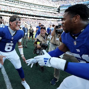 Jaxson Dart #6 of the New York Giants and Abdul Carter #51 of the New York Giants celebrate following a win against the Los Angeles Chargers