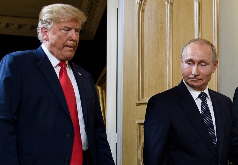 President Donald Trump (L) and Russian President Vladimir Putin arrive for a meeting in Helsinki, on July 16, 2018.