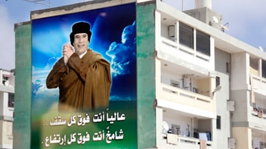 articles/2011/02/19/libya-fights-protests-with-deadly-crackdown/lamen-libya-qaddafi_161295_d5sipc