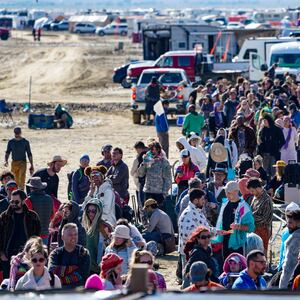 Hundreds of Burning Man attendees who planned to leave on buses wait for information about when they will be able to leave on Labor Day, after a rainstorm turned the site into mud September 4, 2023.