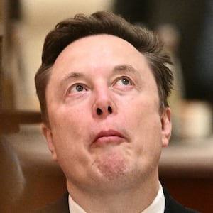 Tesla and SpaceX CEO Elon Musk reacts ahead of a state banquet for US President Donald Trump and China's President Xi Jinping at the Great Hall of the People Beijing on May 14, 2026. (Photo by Brendan SMIALOWSKI / AFP via Getty Images)