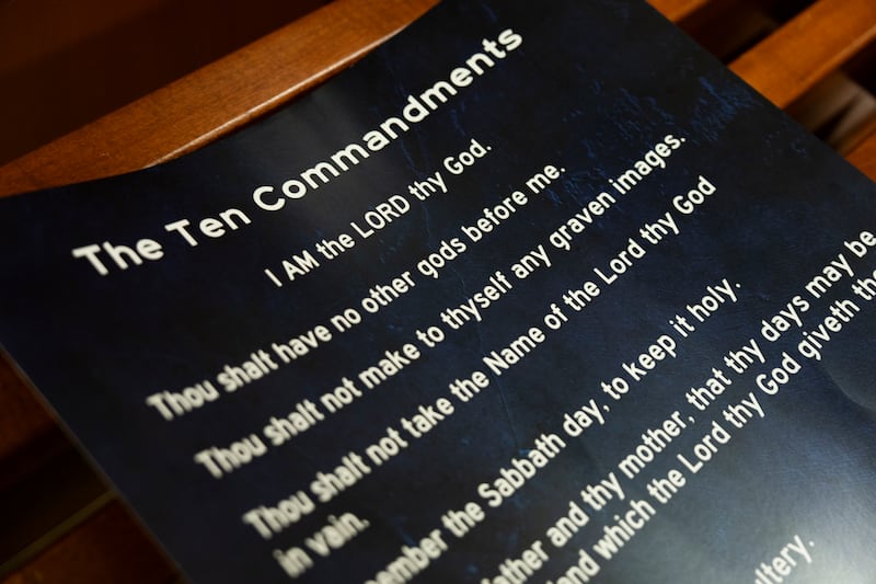 CONROE, TEXAS - AUGUST 19: A poster displaying the Ten Commandments is seen after a Conroe ISD school board meeting in Conroe, Tuesday, Aug. 19, 2025. Texas Senate Bill 10 mandates the display of the Ten Commandments in all public school classrooms effective Sept. 1.