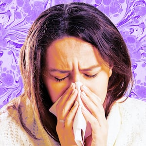A photo illustration of a sick woman blowing her nose.